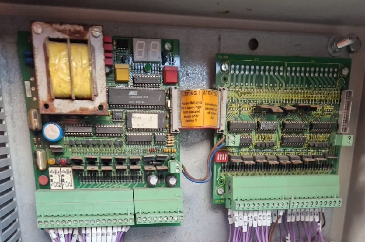 The original valve control circuit boards inside the filter control enclosure
