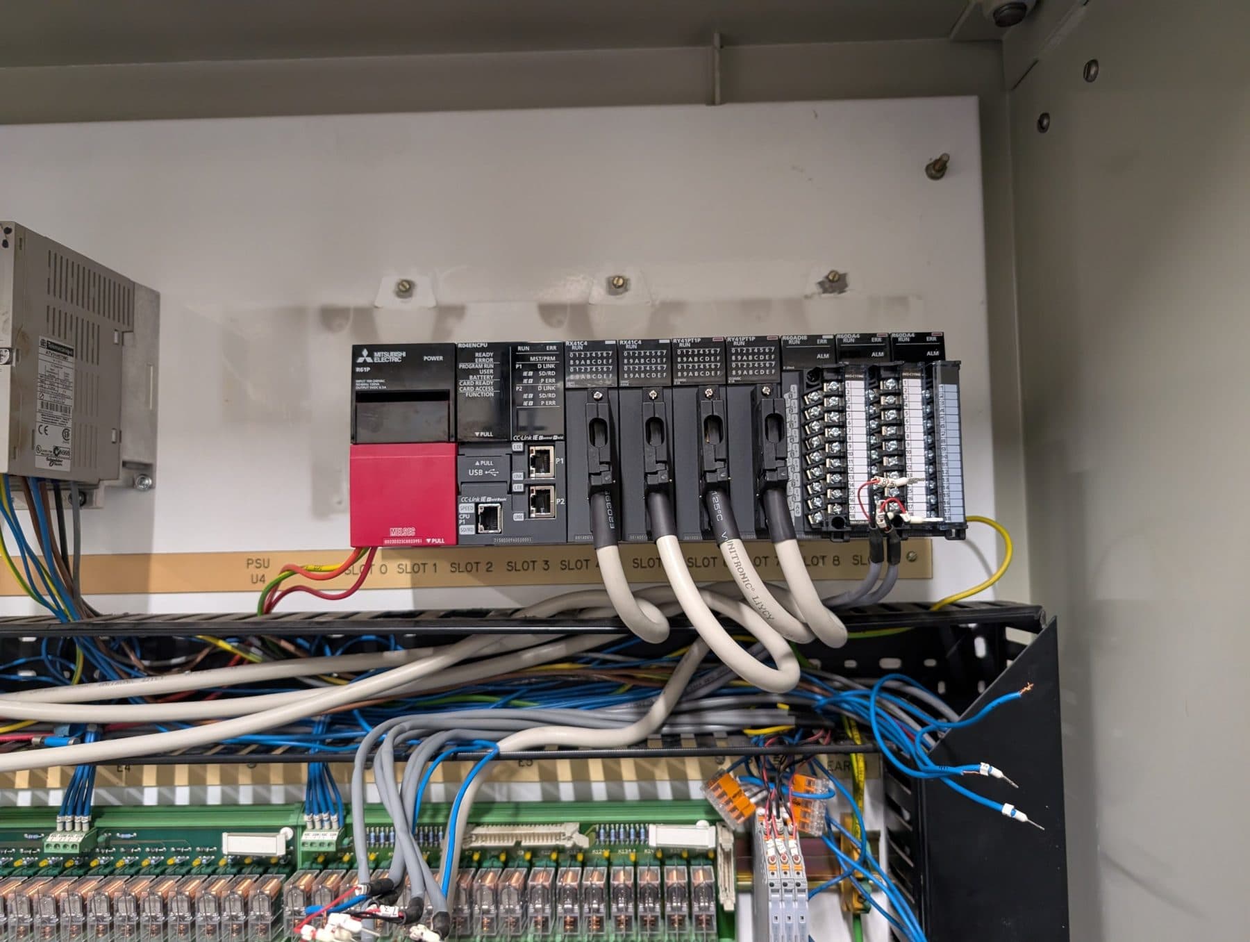 New Mitsubishi iQ-R PLC rack installed in the existing freezer control panel