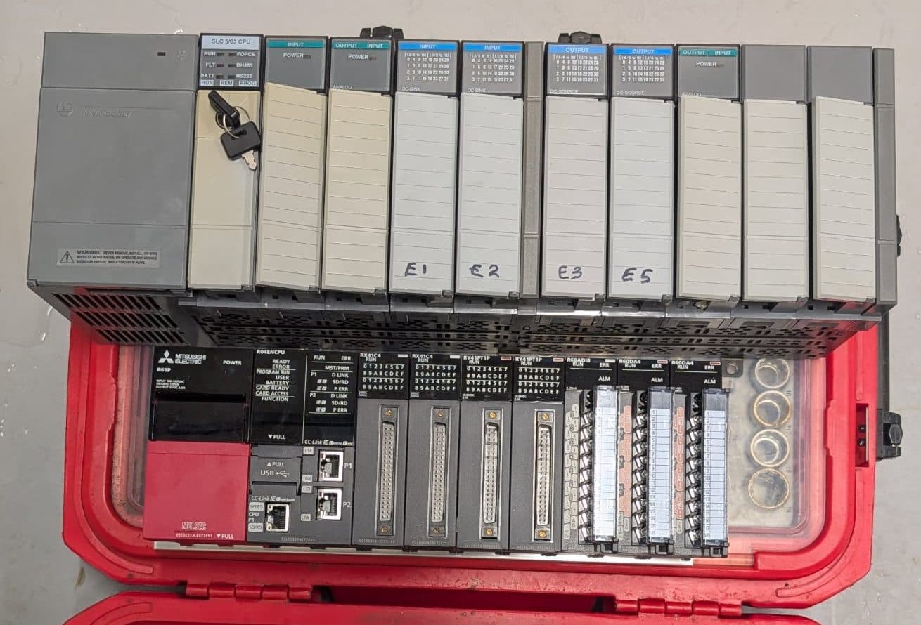 The original Allen Bradley SLC 5/03 rack sitting above the Mitsubishi iQ-R rack that replaced it